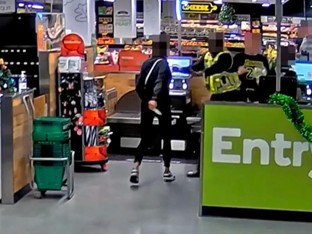 Newly released footage also shows a customer threatening to shiv security workers at a Woolworths self-checkout. Picture: Supplied.