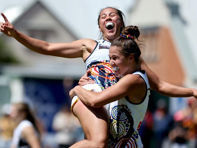 Justine Mules of the Crows celebrates a goal.