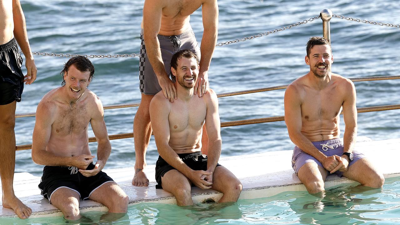 Harry Cunningham (centre) was in good spirits at Sydney’s Bondi Icebergs recovery session on Tuesday after being concussed on the weekend against Essendon. Picture: Phil Hillyard