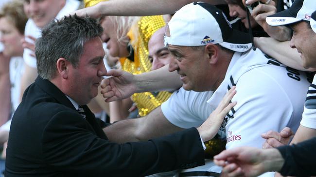 Eddie McGuire celebrating with fans after winning the 2010 grand final.