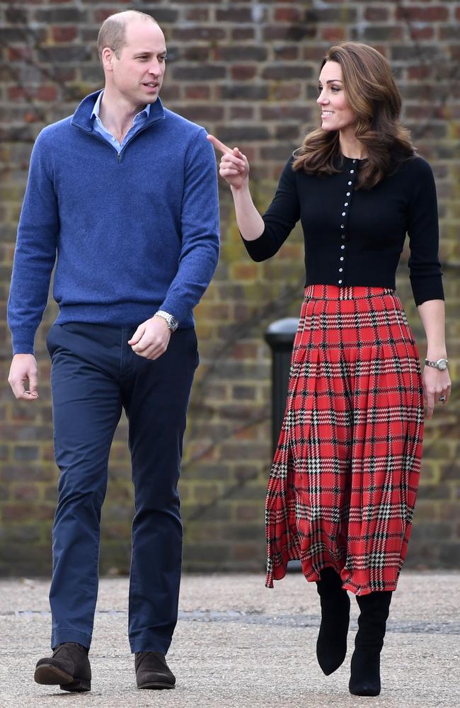 The Duke and Duchess of Cambridge, wearing a festive Emilia Wickstead skirt, at Kensington Palace. Picture: Getty Images