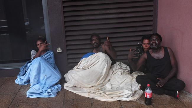 Locals can be seen seeking shelter at the Hilton carpark.