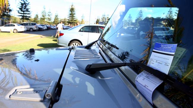 Visitors to Broadbeach were shocked to find a $150 parking fine on their cars after returning from the beach this afternoon in the grassed area next to the Gold Coast City Council parking lot Margaret Avenue, Broadbeach despite the barriers having been taken down and no signs indicating that parking was not permitted.