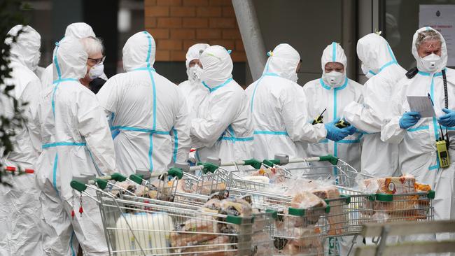 Preparing to deliver food to the residents of one of Melbourne’s public housing towers. Picture: David Crosling