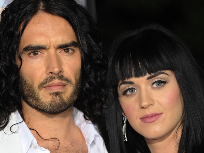 Actor Russell Brand and partner singer Katy Perry pose on the red carpet as they arrive for the premiere of the comedy movie "Get Him to the Greek" from Universal Pictures at the Greek Theatre in Los Angeles on May 25, 2010. AFP PHOTO/Mark RALSTON