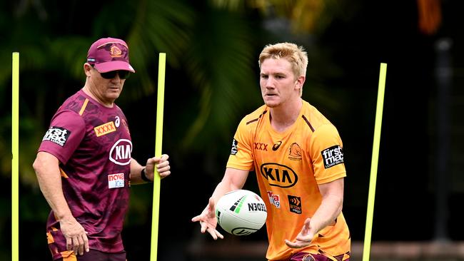 BRISBANE, AUSTRALIA – DECEMBER 01: Tom Dearden runs through a skills drill with Coach Kevin Walters during a Brisbane Broncos NRL training session at the Clive Berghofer Centre on December 01, 2020 in Brisbane, Australia. (Photo by Bradley Kanaris/Getty Images)