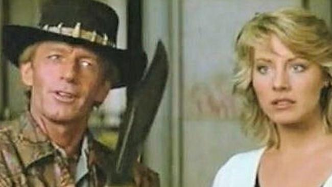 Paul Hogan’s character Mick Dundee brandishes his wares in the famous “That’s not a knife” scene, with Linda Kozlowski playing Sue Charlton. (Pic: Supplied)