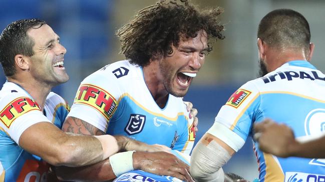 Kevin Proctor celebrates one of his two tries for the Titans against the Broncos. Picture: Getty Images