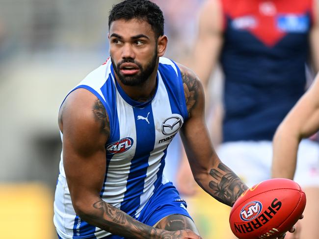 HOBART, AUSTRALIA - AUGUST 06: Tarryn Thomas of the Kangaroos runs the ball during the round 21 AFL match between North Melbourne Kangaroos and Melbourne Demons at Blundstone Arena, on August 06, 2023, in Hobart, Australia. (Photo by Steve Bell/Getty Images)