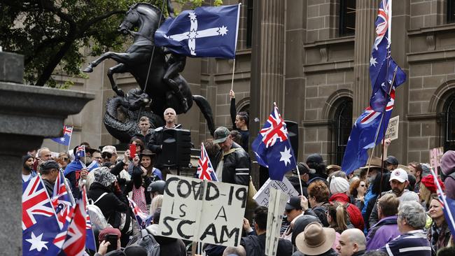 Protesters fly flags at as they rail against the proposed pandemic bill, vaccine passports, mandates and the existence of Covid. Picture: Alex Coppel.