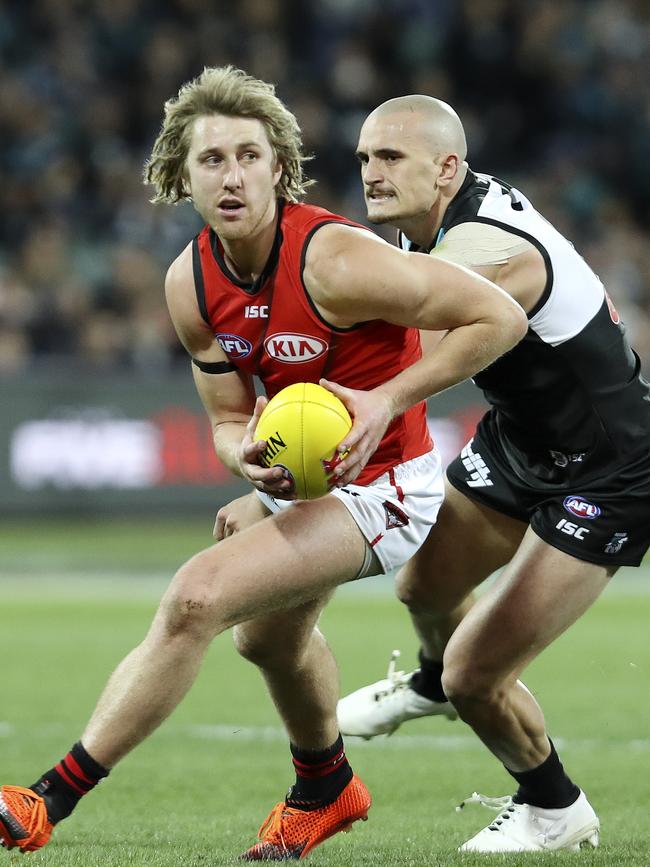 Essendon’s Dyson Heppell evades Port Adelaide’s Sam Powell-Pepper at the Adelaide Oval.  Picture SARAH REED