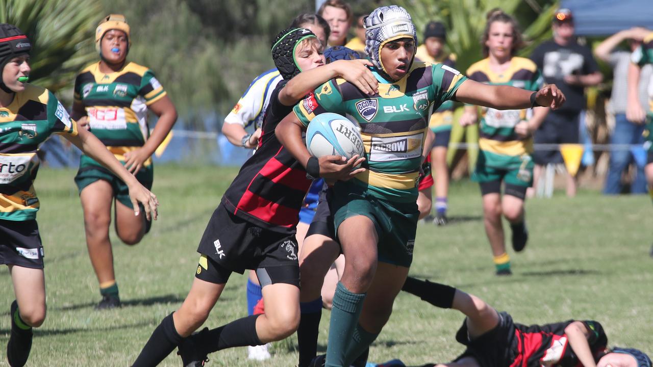 King of the Country U/13 Rugby Union tournament at Overall park Southport. Surfers Paradise(Yellow Green ) V Far North Coast (red black). Picture Glenn Hampson