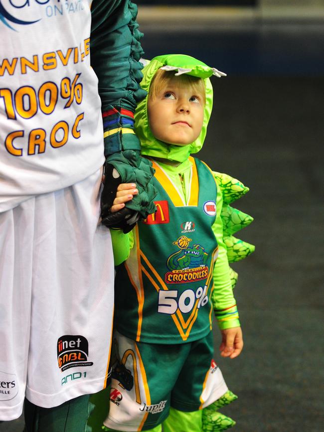 The Townsville Crocodiles mascot 100 Croc at The Swamp. Shaun Williams with daughter Chelsea.
