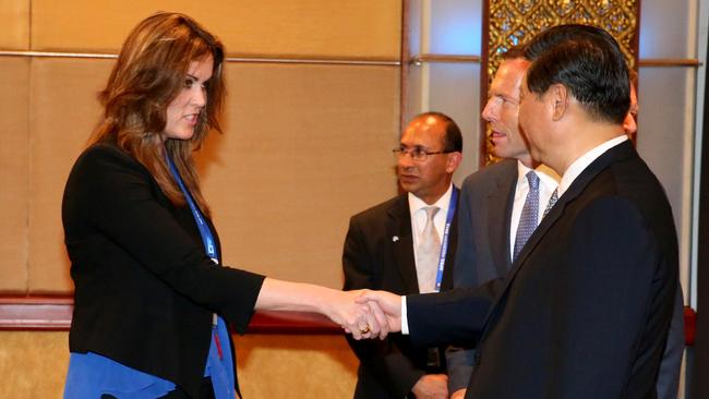 Tony Abbott introduces his chief of staff Peta Credlin to Chinese President Xi Jiinping on the sidelines of APEC in Bali.