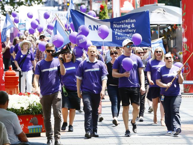 Nurse and midwifery union members walked from the Royal Hobart Hospital to Parliament Lawns to rally against the Government’s pay offer. Picture: MATT THOMPSON