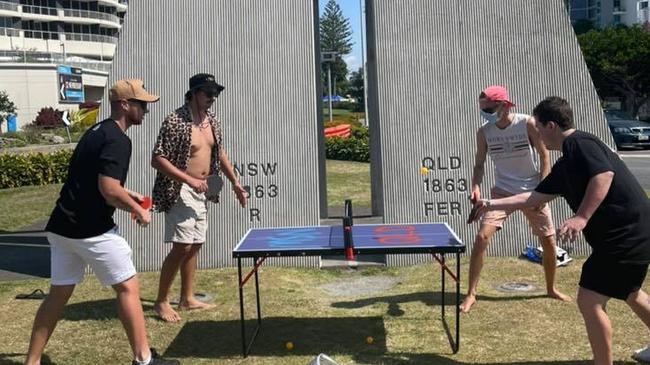 A group of mates takes to the border for a friendly game of table tennis.