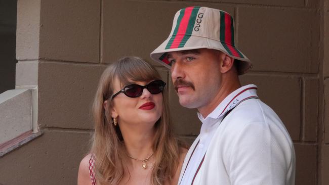 TOPSHOT - US musician Taylor Swift (L) and US NFL football player Travis Kelce (R) attend the men's final match between Italy's Jannik Sinner and USA's Taylor Fritz on day fourteen of the US Open tennis tournament at the USTA Billie Jean King National Tennis Center in New York City, on September 8, 2024. (Photo by TIMOTHY A. CLARY / AFP)