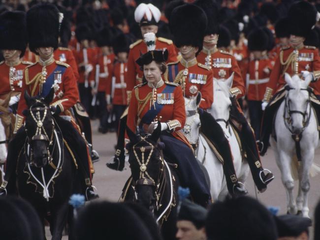 Queen Elizabeth during the Trooping the Colour procession in 1981 with the future King Charles to her left and her late husband Prince Phillip behind. Picture: Tim Graham/Getty