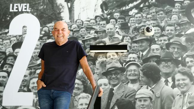 Bob Gartland with one of the large photo walls in the new Joel Selwood stand. Picture: Alison Wynd