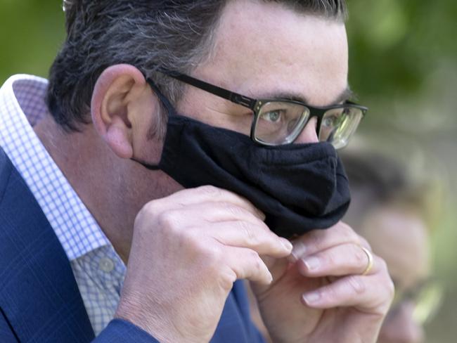 MELBOURNE, AUSTRALIA - NewsWire Photos December 2 2020: Victorian Premier Daniel Andrews puts on a mask after speaking at a press conference in Mont Albert on Wednesday morning. Picture: NCA NewsWire / David Geraghty