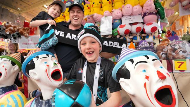 Port supporters Mackenzie Jarvis with his daughter Maggie, 7, and son, Jimmy, 5, enjoying the show. Picture: Dean Martin