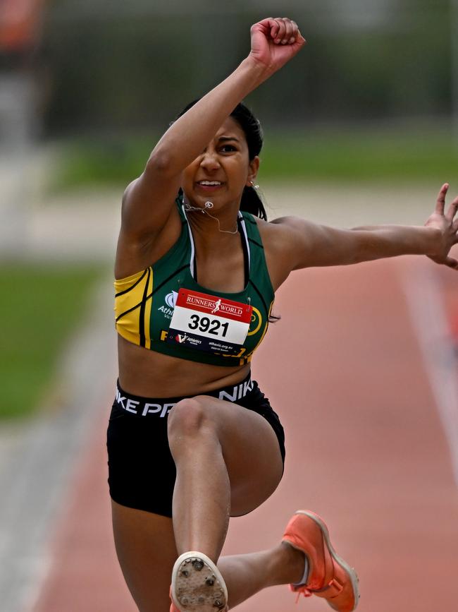 Neha Liyanage goes for distance in the triple jump. Picture: Andy Brownbill