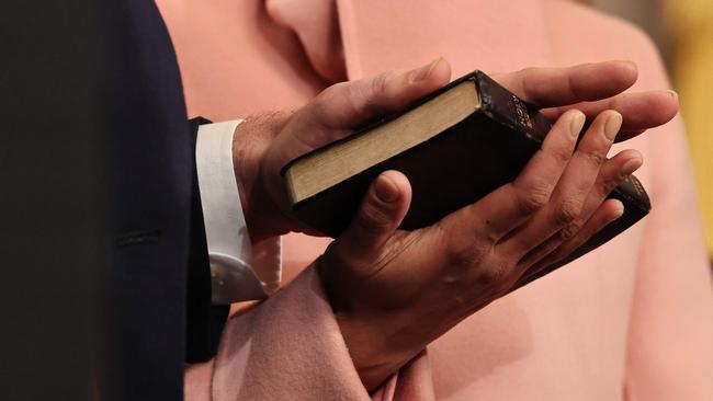 Vice President JD Vance takes the oath of office with his hand on a Bible that once belonged to his great-grandmother and held by his wife Usha Vance. Picture: Chip Somodevilla/Getty Images/AFP