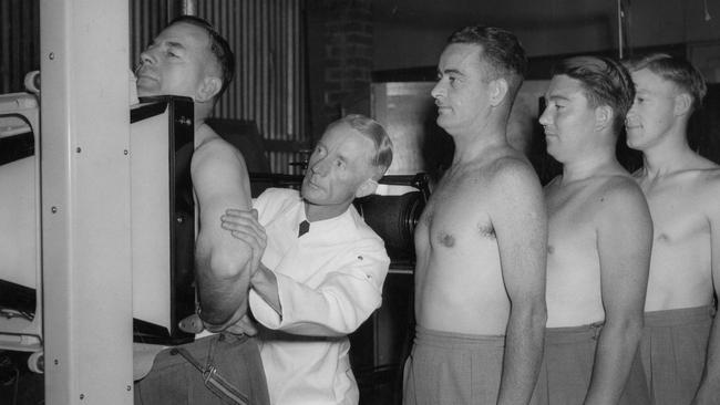 Staff at Kelvinator line up for X-ray tests for tuberculosis at the factory in 1950.