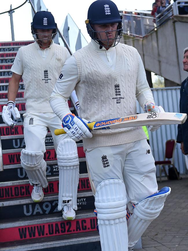 Jason Roy, right, and Joe Denly walk out to bat. Picture: AFP