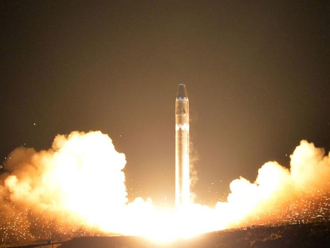 FILE - This Wednesday, Nov. 29, 2017, file image provided by the North Korean government on Thursday, Nov. 30, 2017, shows what the North Korean government calls the Hwasong-15 intercontinental ballistic missile, at an undisclosed location in North Korea. Cathay Pacific said in a statement Monday, Dec. 4, the crew on a San Francisco-to-Hong Kong flight reported witnessing the apparent re-entry of the ICBM that North Korea launched before dawn Wednesday. Independent journalists were not given access to cover the event depicted in this image distributed by the North Korean government. The content of this image is as provided and cannot be independently verified. Korean language watermark on image as provided by source reads: "KCNA" which is the abbreviation for Korean Central News Agency. (Korean Central News Agency/Korea News Service via AP)