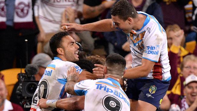 BRISBANE, AUSTRALIA — MAY 13: Konrad Hurrell of the Titans is congratulated by team mates after scoring a try during the round 10 NRL match between the Melbourne Storm and the Gold Coast Titans at Suncorp Stadium on May 13, 2017 in Brisbane, Australia. (Photo by Bradley Kanaris/Getty Images)