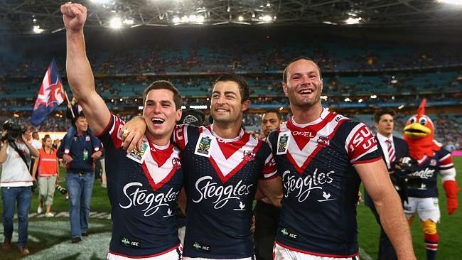 Roosters players Daniel Mortimer, Anthony Minichiello and Boyd Cordner celebrate their win. Picture: Getty