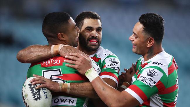 SYDNEY, AUSTRALIA - JUNE 14: Robert Jennings of the Rabbitohs (L) celebrates with Greg Inglis (C) and John Sutton (R) after scoring a try during the round 15 NRL match between the Parramatta Eels and the South Sydney Rabbitohs at ANZ Stadium on June 14, 2018 in Sydney, Australia. (Photo by Matt King/Getty Images)