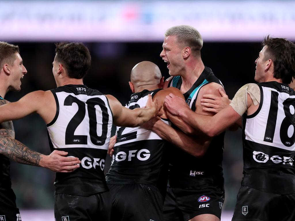 Peter Ladhams celebrates with his teammates.