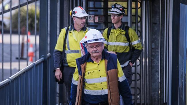 Workers leave the TEMCO smelter after their shift.