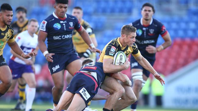 Western Force’s Kyle Godwin is tackled by the Melbourne. Picture: Getty Images