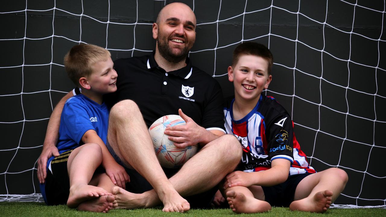 Steve Fazio plays soccer with his sons in their backyard. Picture Jeff Darmanin