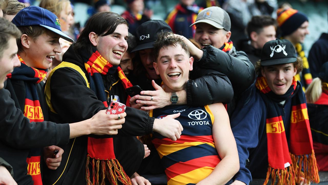 Patrick Parnell is hugged by his mates earlier this year. Picture: Mark Brake/Getty