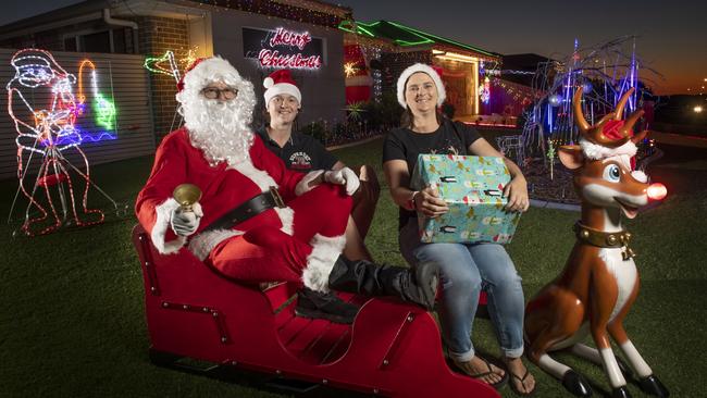 (from left) Scott, Sam and Kellie Iseppi. The Iseppi family Christmas lights display at &amp; Lockyer St Kleinton. Friday, December 10, 2021. Picture: Nev Madsen.