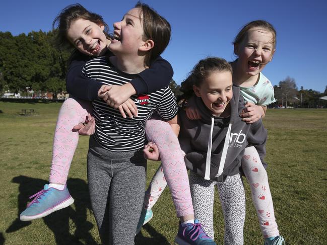 Allie Hamilton, 8, Rosie Blatch, 11, Taylor Hamilton, 11, and Darcy Ward, 7, playing in Queens Park, Sydney. Picture: Justin Lloyd.