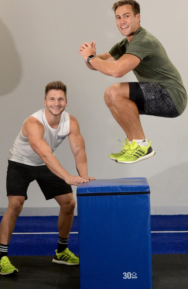 F45 is the new fitness craze in Melbourne - it's a 45 high intensity circuit workout. Trainer Michael Ramsey (left) and Neighbours star Matt Wilson. Picture: Kylie Else