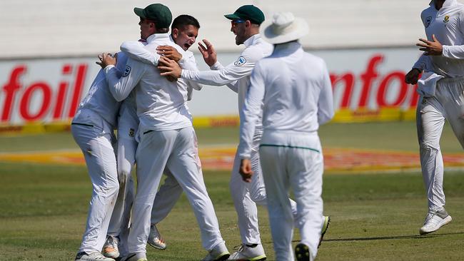 Keshav Maharaj celebrates with teammates after the dismissal of Steve Smith. Picture: AFP.