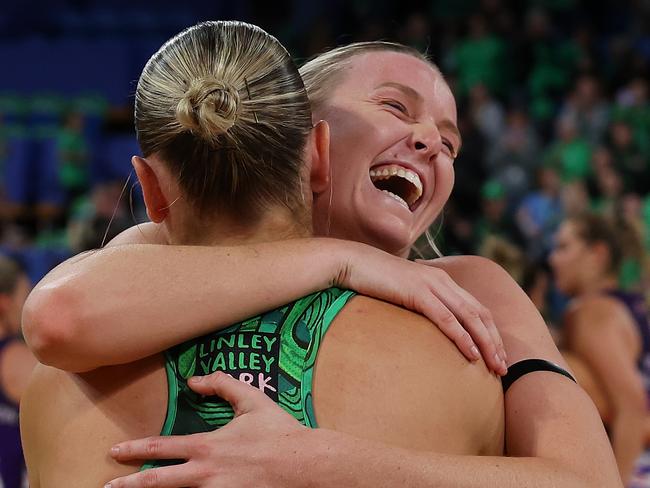 Sasha Glasgow and Courtney Bruce celebrate the West Coast Fever’s historic win over the Queensland Firebirds. Picture: Paul Kane/Getty Images