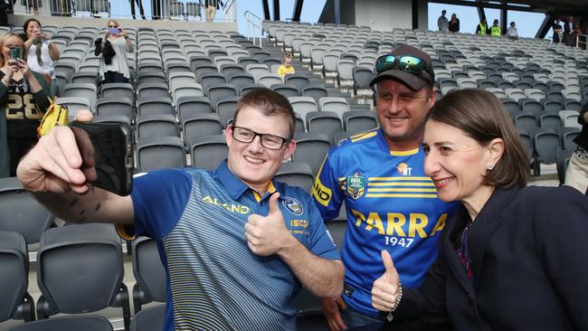 NSW Premier Gladys Berejiklian with Parramatta fans Troy Worner and Geoff Cooke give the new stadium the thumbs up with the Premier. Picture: David Swift.