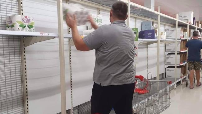 Toilet paper shelves soon emptied at Newmarket Coles after the lockdown announcement.