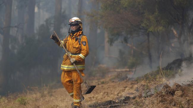 TFS crews conduct a backburn at the top of Kermandie River Rd in Geeveston after a bulldozer was used to create a containment line. Picture: RICHARD JUPE