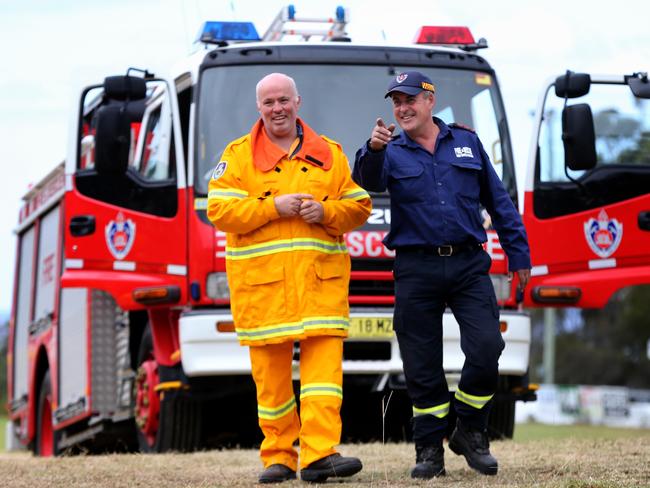 Adam Wiggins, Tathra RFS Captain (left), and Gerard Hanscombe, Bega Fire and Rescue Captain,  at Tathra on the NSW South Coast after the weekend's devastating fires. Picture: Ray Strange.