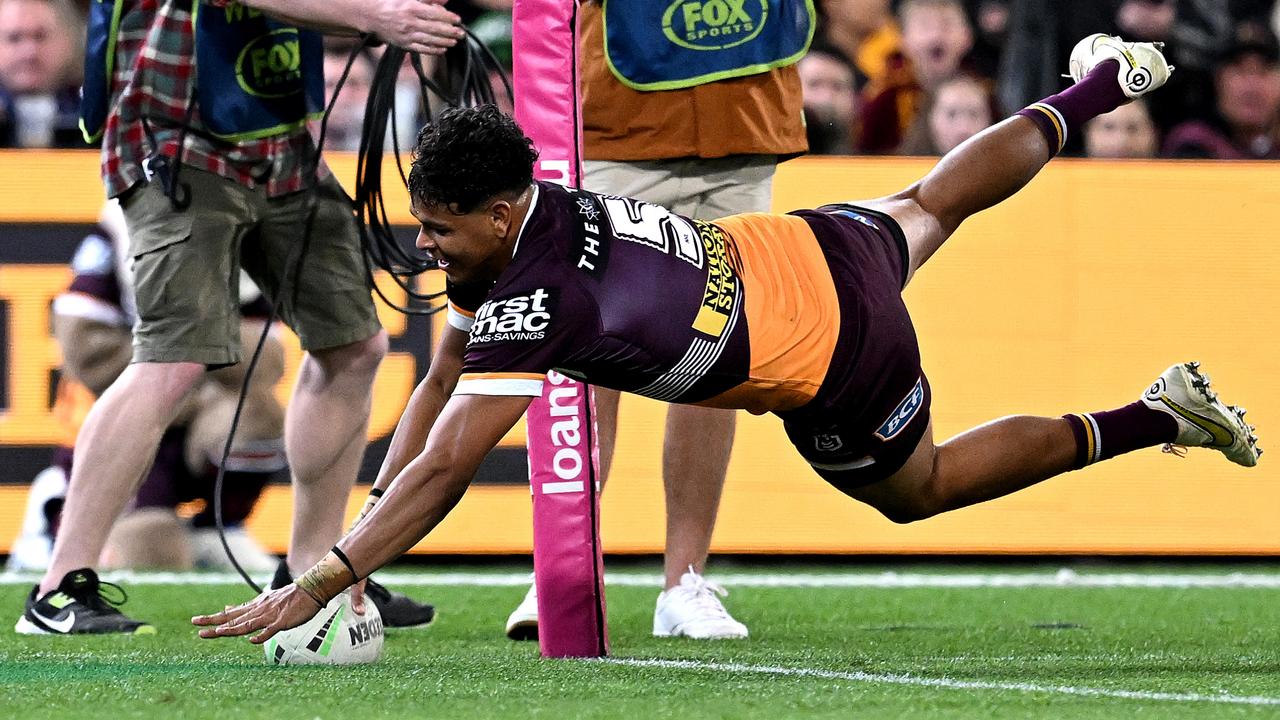 Selwyn Cobbo scores his hat trick try at the Gabba. Picture: Bradley Kanaris/Getty