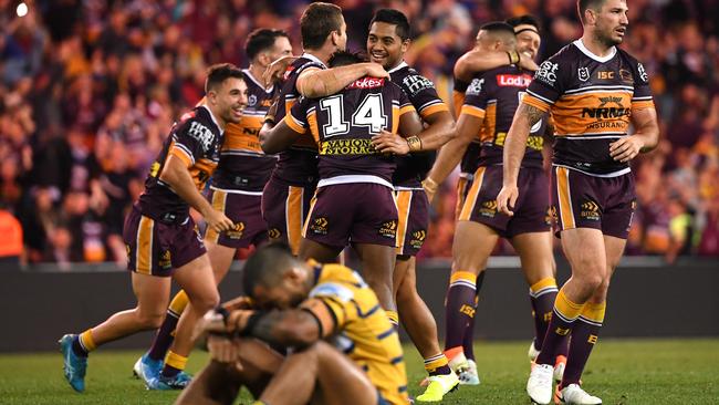 Broncos players celebrate Jamayne Isaako’s matchwinning field goal. Picture: AAP