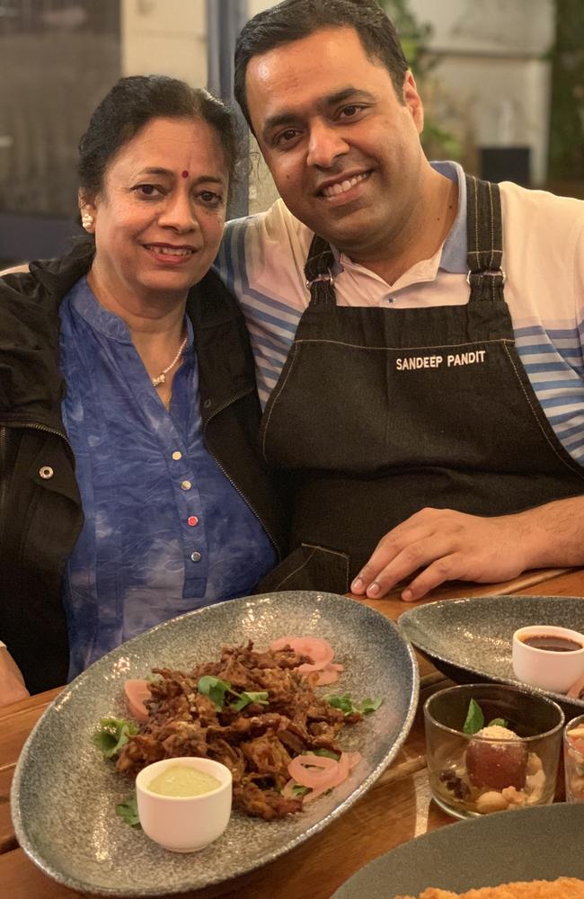 Former Master Chef contestant Sandeep Pandit (pictured here with his mother in India) is launching his own fundraising for India including auctioning his prized MC kit. Picture: supplied